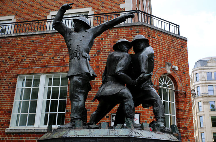 The National Fire Fighters Memorial depicts three fire fighters in action the morning after the Blitz