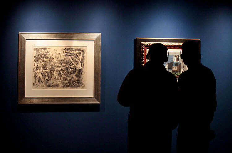 Two men admire an artwork by Picasso at Vivanco in La Rioja, Spain