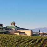 The modern and minimalistic Vivanco winery surrounded by vineyards with the mountains in the distance in La Rioja, Spain