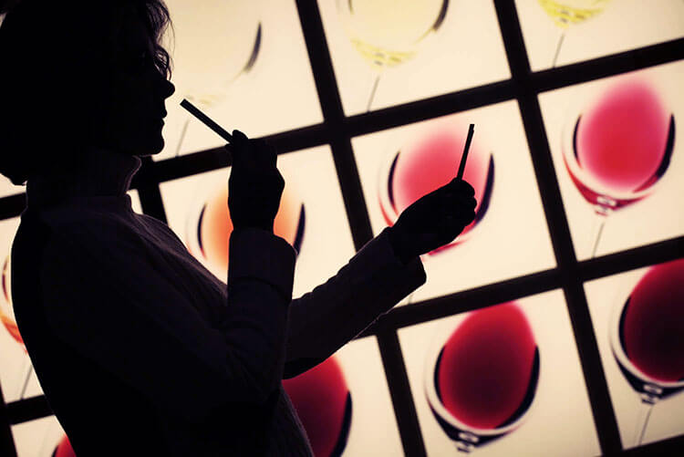A woman smells aromas in the interactive museum at Vivanco