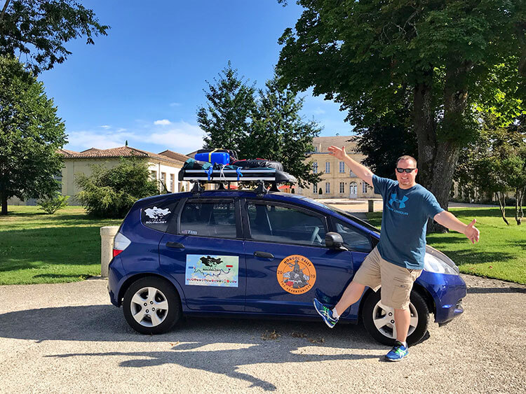 Tim poses with his car outside Château Soutard in Saint-Émilion