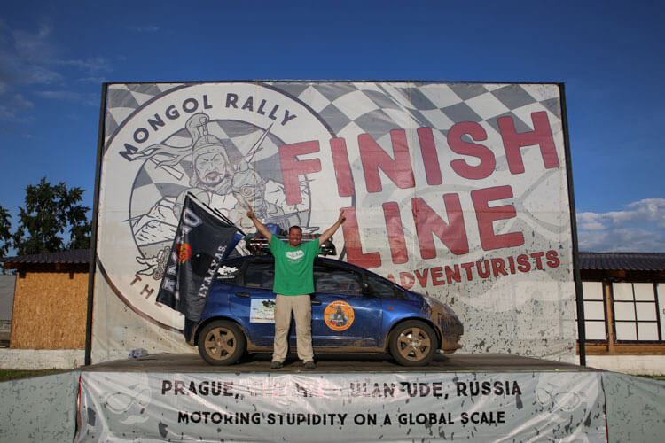 Tim with his car at the finish line of the Mongol Rally in Ulan Ude, Russia