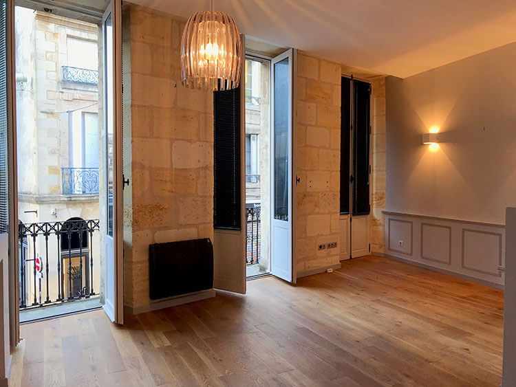 The living room with three balconies in our new Bordeaux apartment