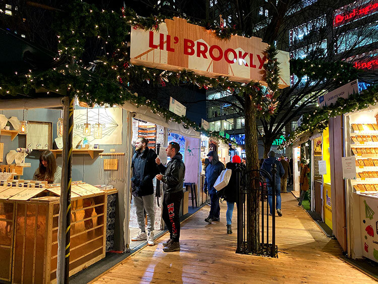 The Lil' Brooklyn section of the Union Square Holiday Market with stalls selling Brooklyn made wares like NYC puzzles