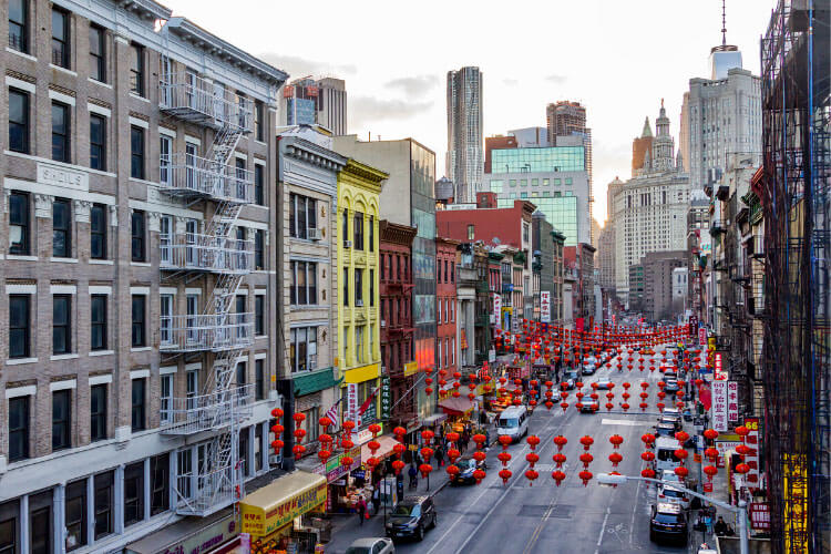 A view of Chinatown with Chinese lanterns hanging over the street in NYC