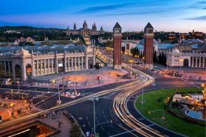 Plaça d'Espanya at blue hour with light trails from the traffic