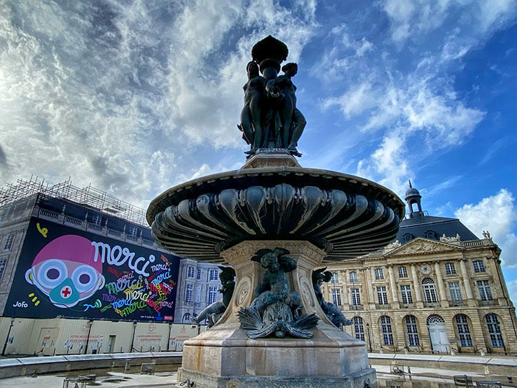 Street art mural by JoFo to thank healthcare workers on Place de la Bourse