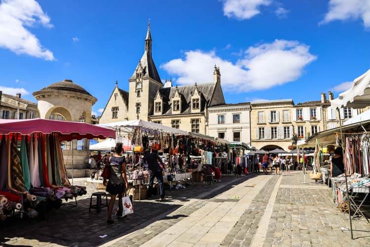 Market stalls set up on Place Abel Surchamp in Libourne, France