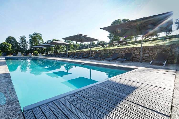 The swimming pool of l'Abbaye du Palais resort in Creuse