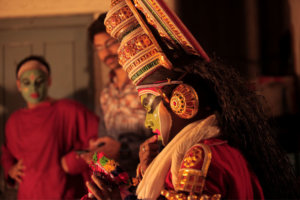 Kathakali performers dressed up in elaborate costumes