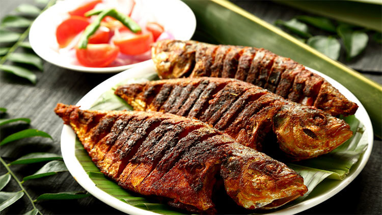 Fish fried and served on plantain leaves in Kerala, India
