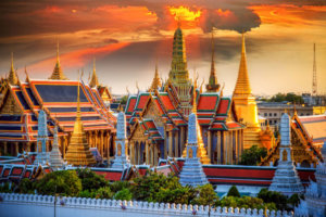 The various buildings of the Grand Palace in Bangkok at sunset