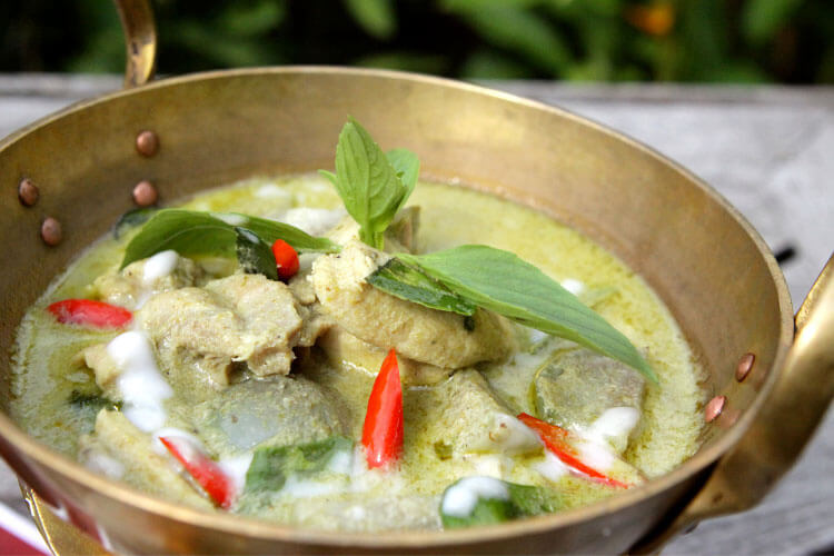 The nearly finished Thai green curry in the pan at a Bangkok Thai cooking class