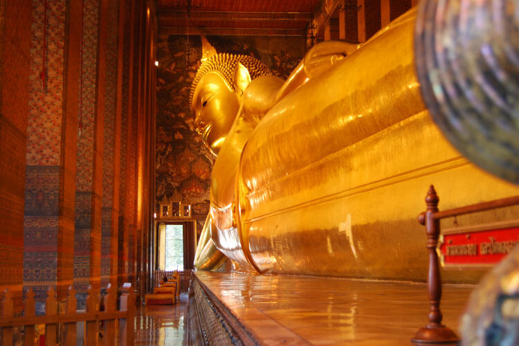 The Reclining Buddha stretches the length of the Wat Pho in Bangkok