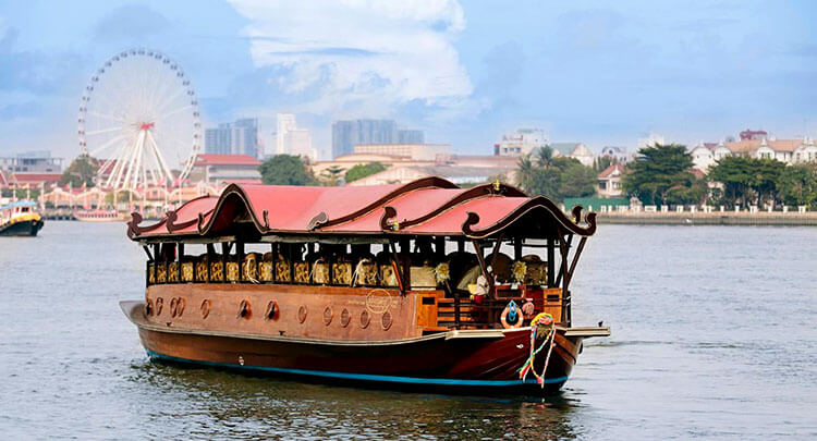 The wooden manohra cruise boat on the Chao Phraya River in Bangkok