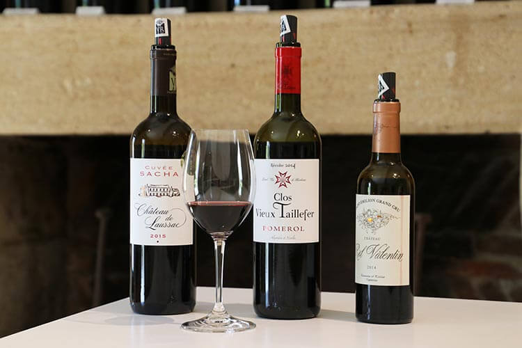 Three wines of the estates of Château Rol Valentin lined up in the tasting room