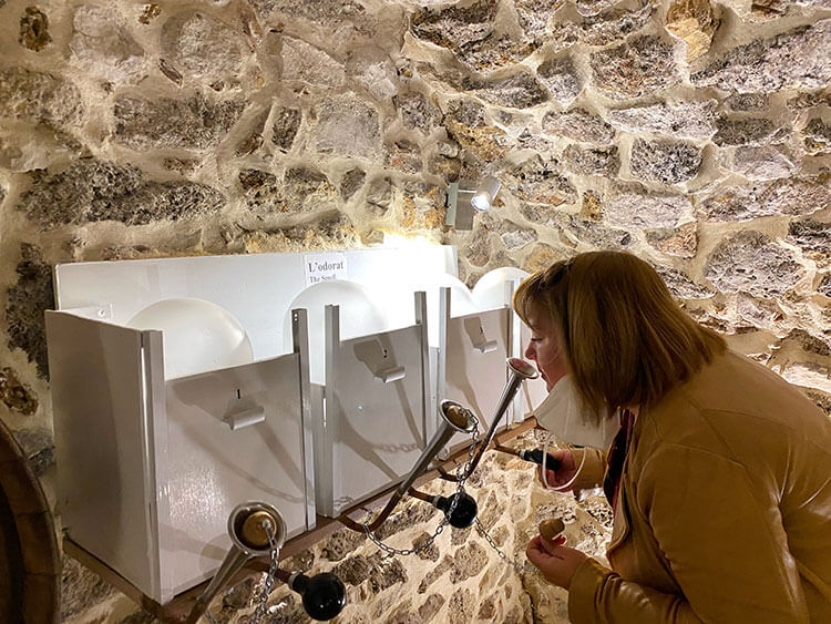 Jennifer at the aromas station sniffing one of the scents at Champagne Lévêque-Dehan