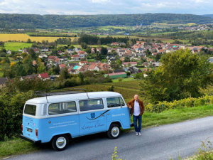 Eric from Champagne Lévêque-Dehan poses with the VW Kombi and a magnificent view over the Marne Valley