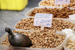 A vendor sells pistachios at the market in Catania, Sicily