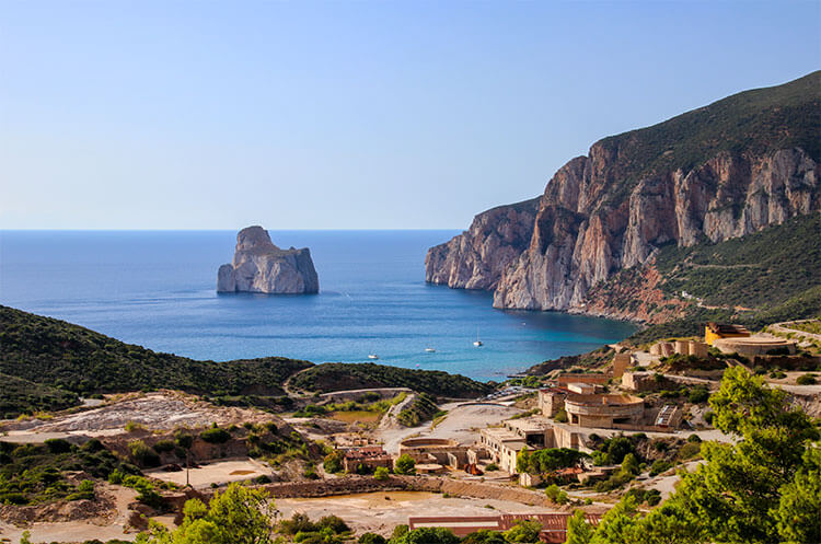 A viewpoint over the Porto Flavia mining site with the beautiful coastline of Sardinia