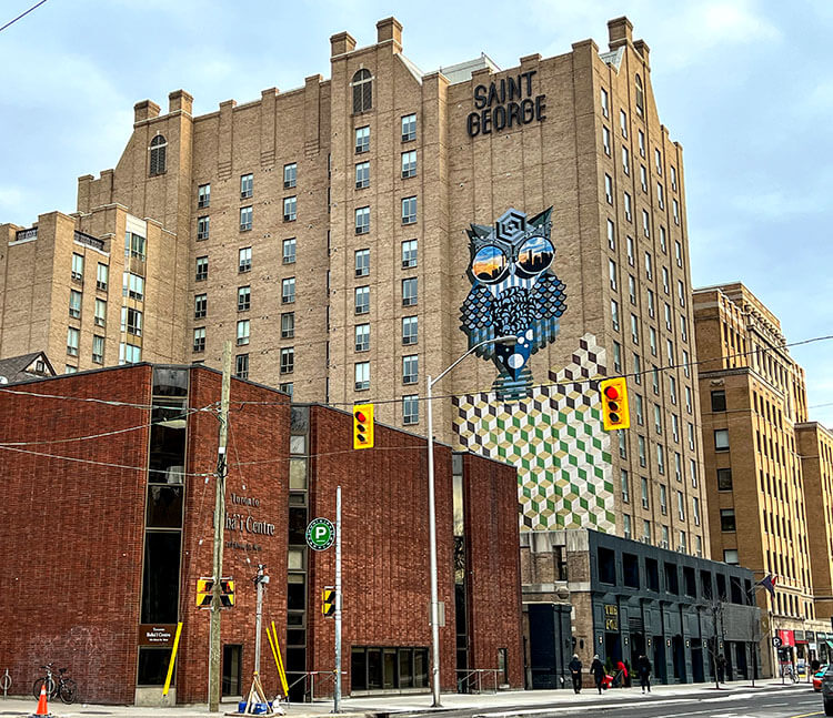 A giant owl mural by local street artist BirdO adorns the side of the Kimpton Saint George in Toronto, Canada