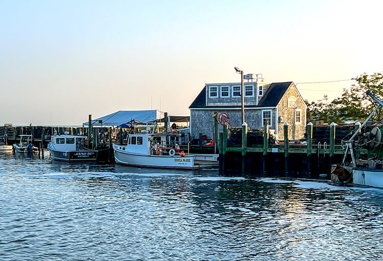 Guilford Lobster Pound at sunset at the end of the dock juts out into protected salt marsh in Guilford, Connecticut