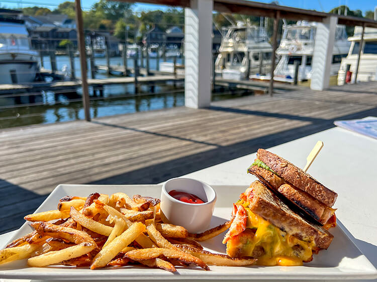 The lobster grilled cheese served with fries on the deck of Red 36 overlooking the Mystic River in Mystic, Connecticut