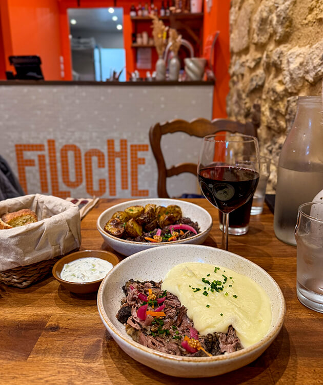 The pulled lamb plate with pickled vegetables and mashed potatoes and the pulled beef a la Bordelaise plate with roast baby potatoes at Filoche