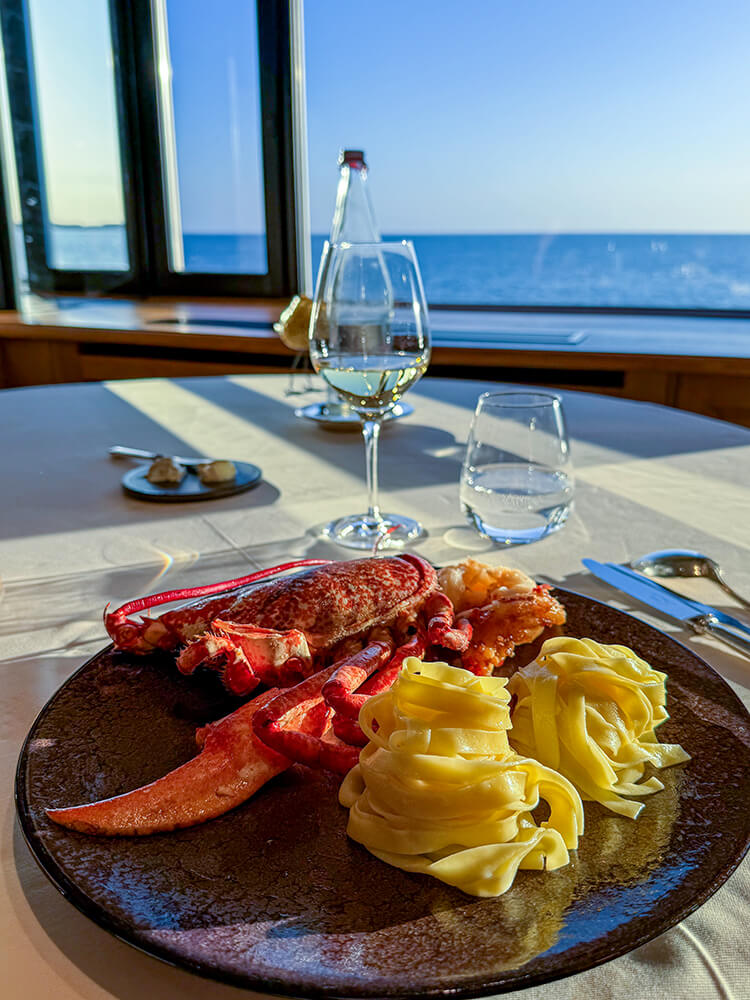 Breton blue lobster tail and claw served with tagliatelle at the restaurant at Domaine de Rochevilaine