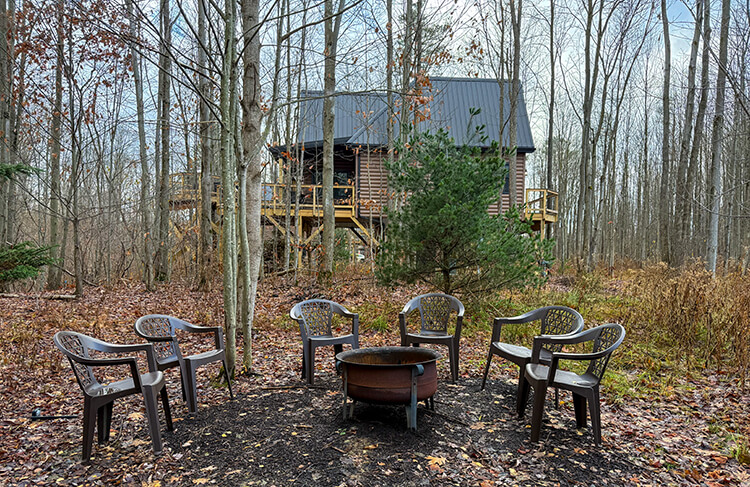 Each treehouse has its own firepit area