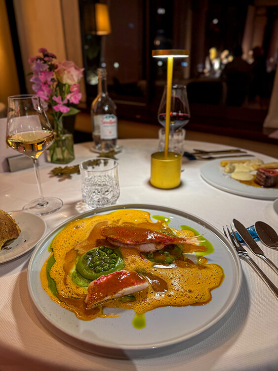 Striped red mullet with peas and bouillabaisse at L'Almandin at Hotel L'Île de la Lagune in Saint-Cyprien, France