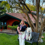 Jennifer and Coco pose for a photo in front of the main hotel building of Les Frères Ibarboure