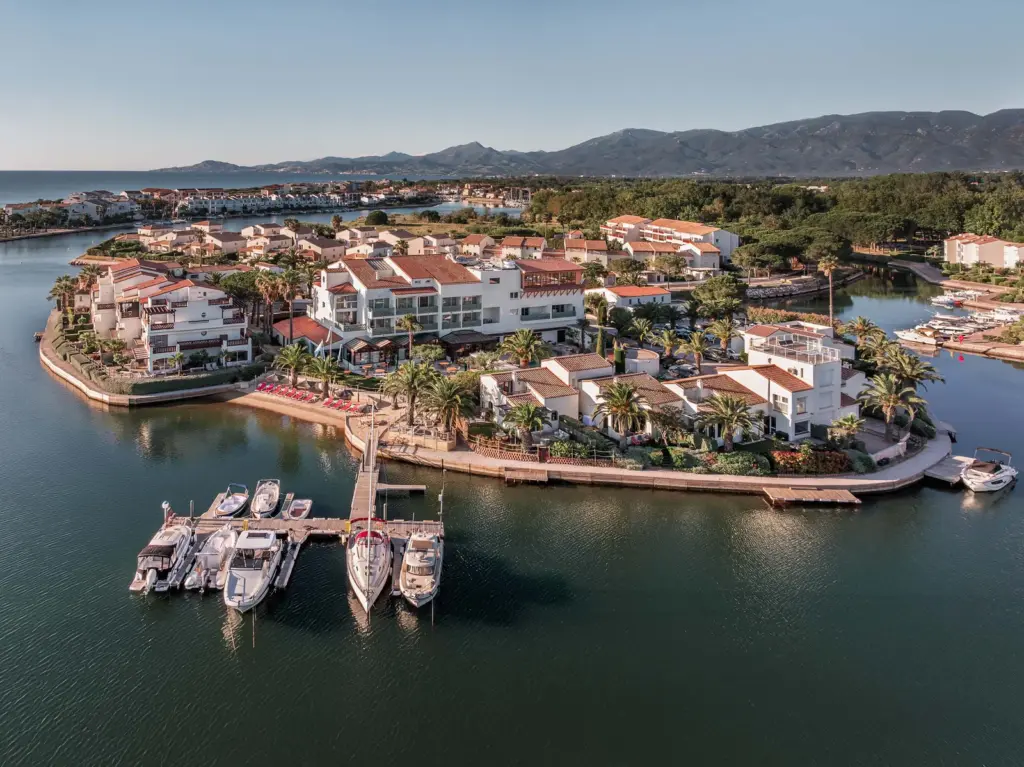 Drone shot of the private island ofo Hotel L'Île de la Lagune in Saint-Cyprien, France