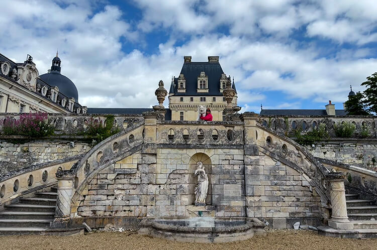 Jennifer and Coco post on the terraces balcony of the Château de Valençay in the Loire Valley