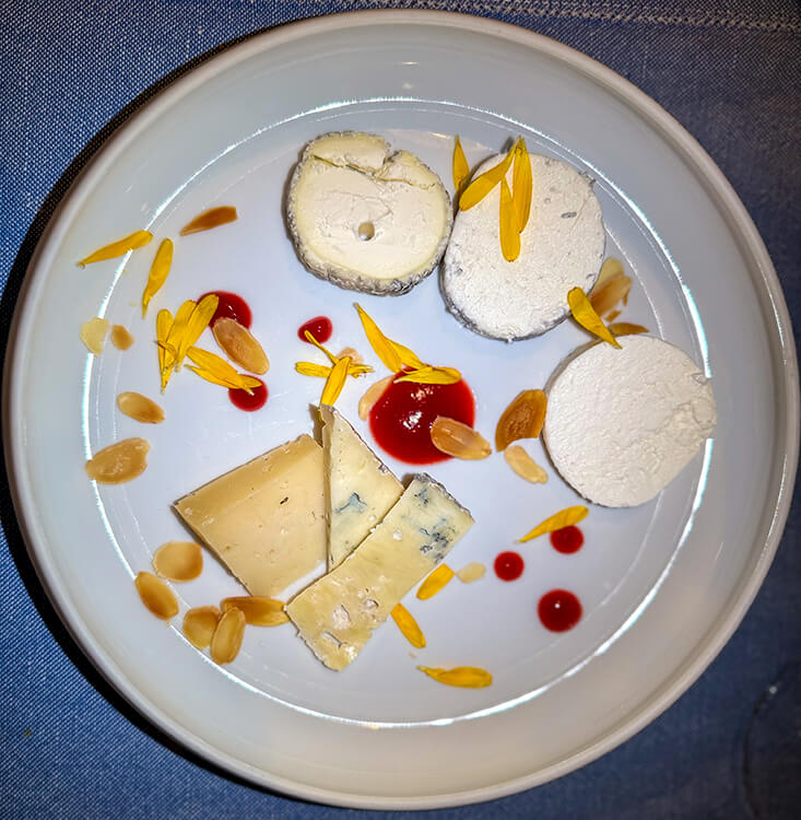Five types of goat cheese from the Loire Valley with edible flowers and jam at Le Jardin Secret at Château du Rivau