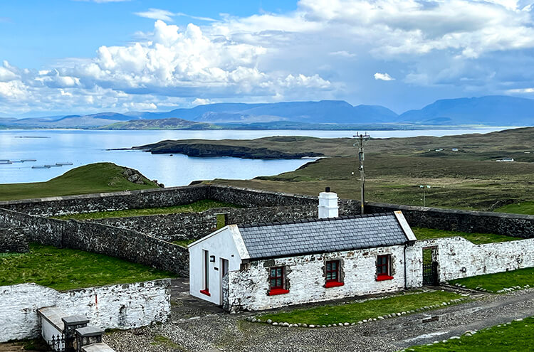 The outbuilding where the Sauna Suite is located as seen from the top of the light tower with views of the sea and Croagh Patrick across Clew Bay at Clare Island Lighthouse