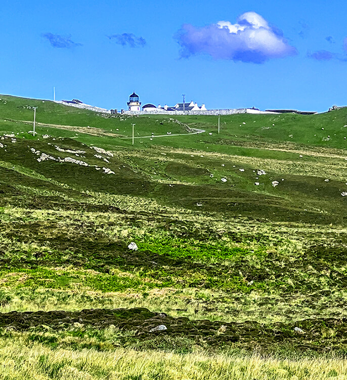 The Clare Island Lighthouse seen from the distance along the Lighthouse Loop Trail