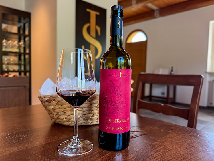 A glass and bottle of Josetta Saffirio Winery Barbaresco at the tasting at the winery in Barolo