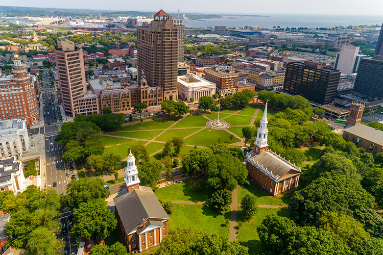 Aerial photo of the three historic churches on New Haven Green and skyline of Yale University