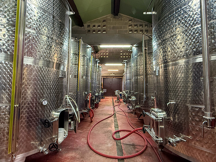 Steel vats line the winery at Querceto di Castellina